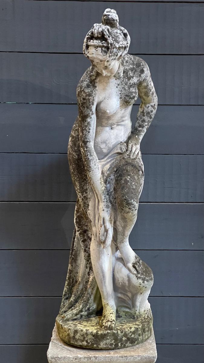 Concrete garden statue of lady 