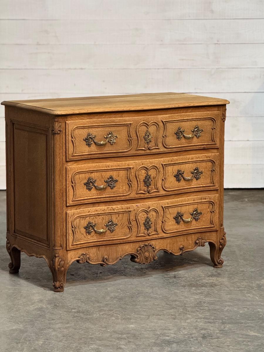 Bleached oak serpentine chest of drawers 