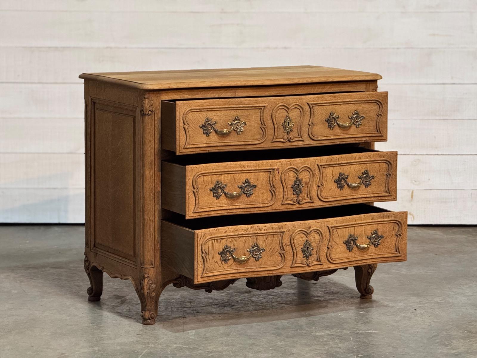 Bleached oak serpentine chest of drawers 