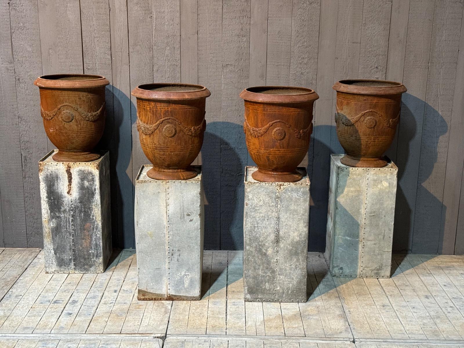 Four cast iron Anduse vases 