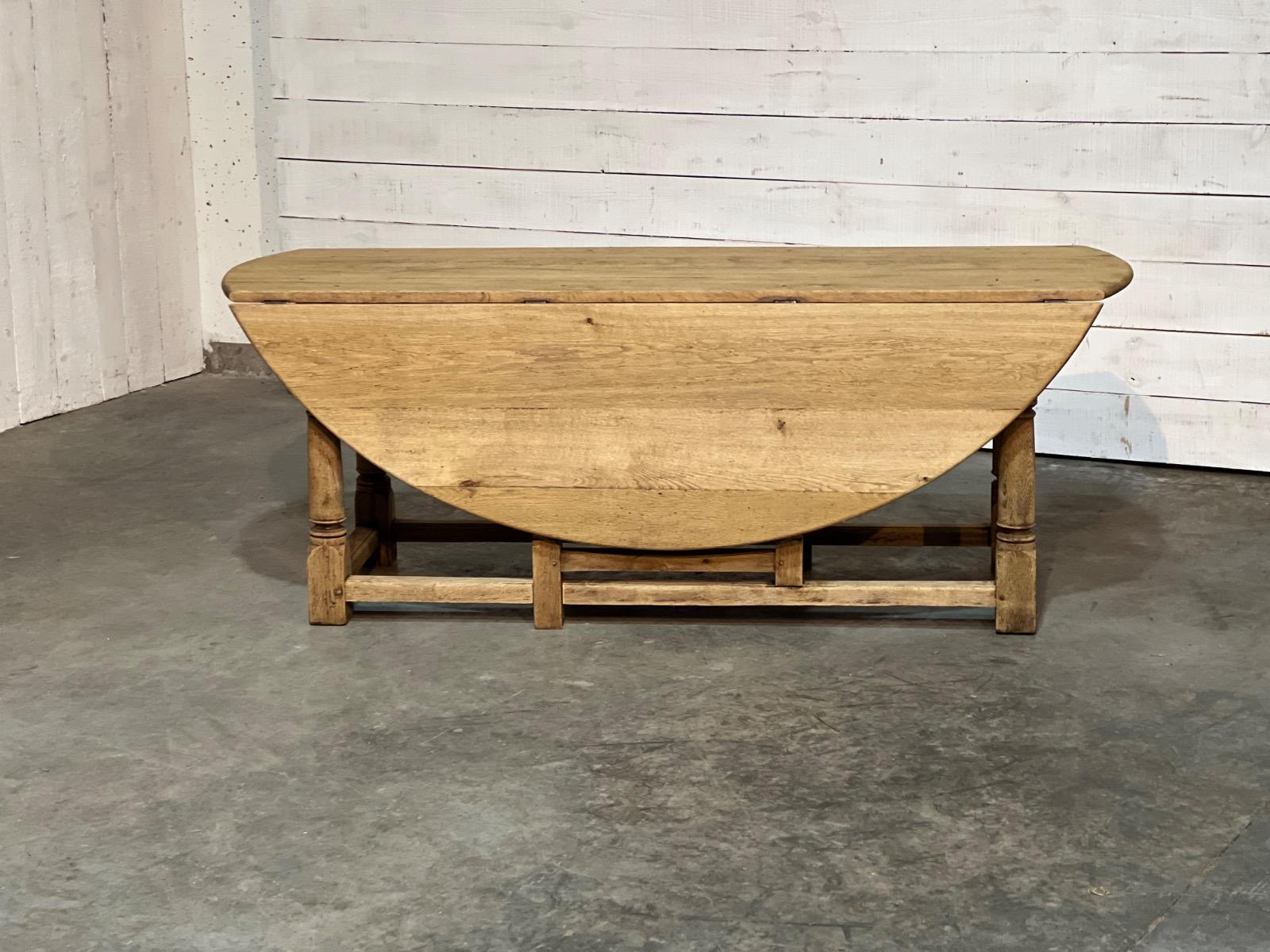 Large bleached oak oval dining table 