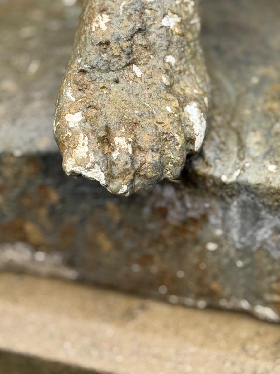 Large garden statue of putti on pedestal