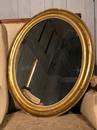 Miroir doré oval