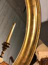 Miroir doré oval