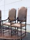 Série de 4 fauteuils en cuir et têtes de bélier