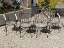 Wrought iron and teak garden chairs 