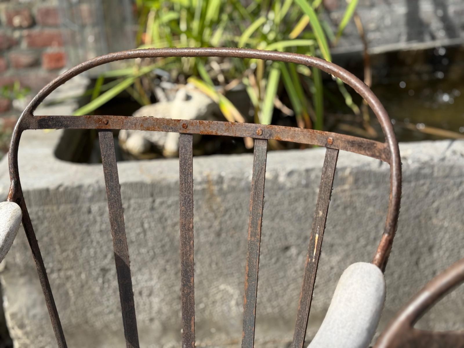Wrought iron and teak garden chairs 