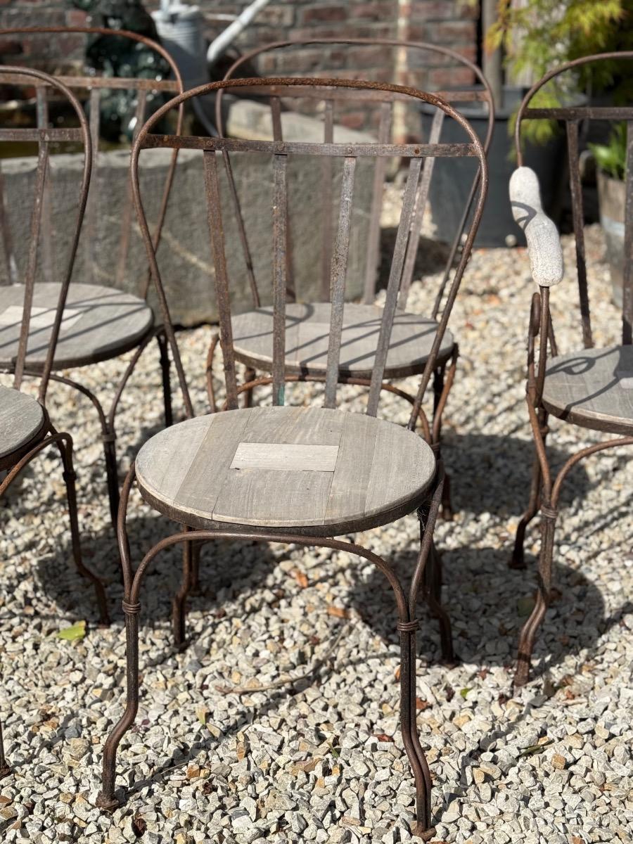 Wrought iron and teak garden chairs 