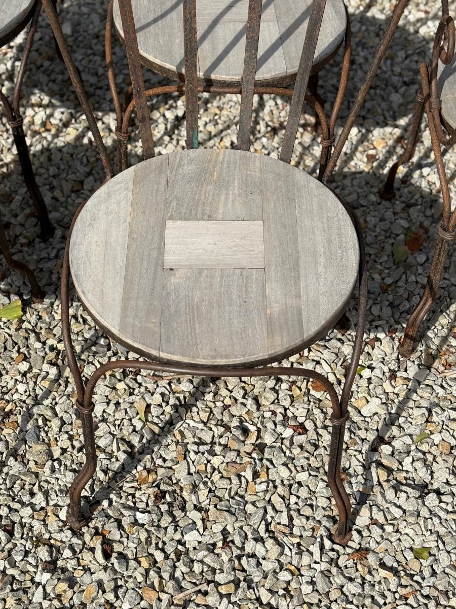 Wrought iron and teak garden chairs 
