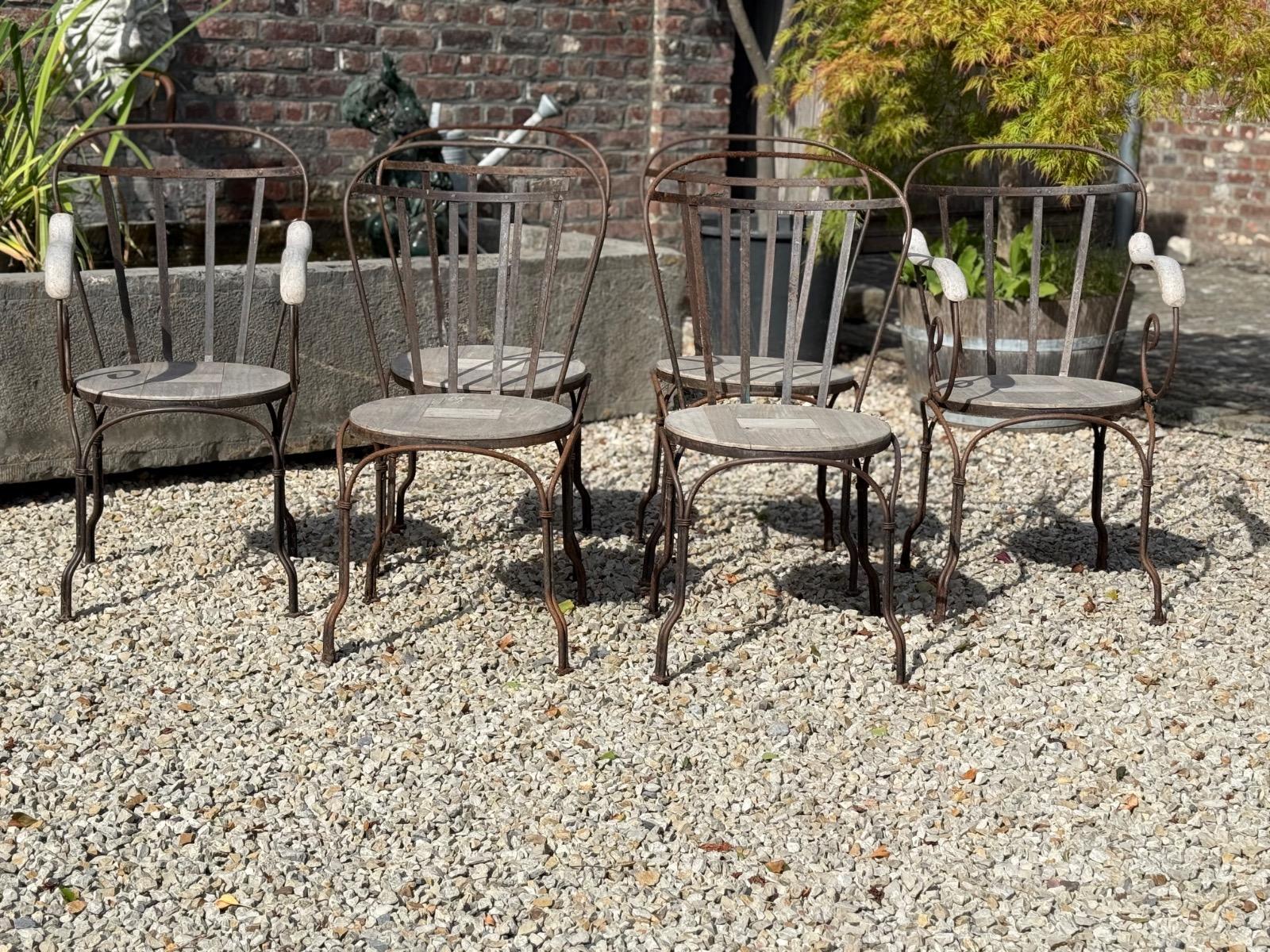 Wrought iron and teak garden chairs 