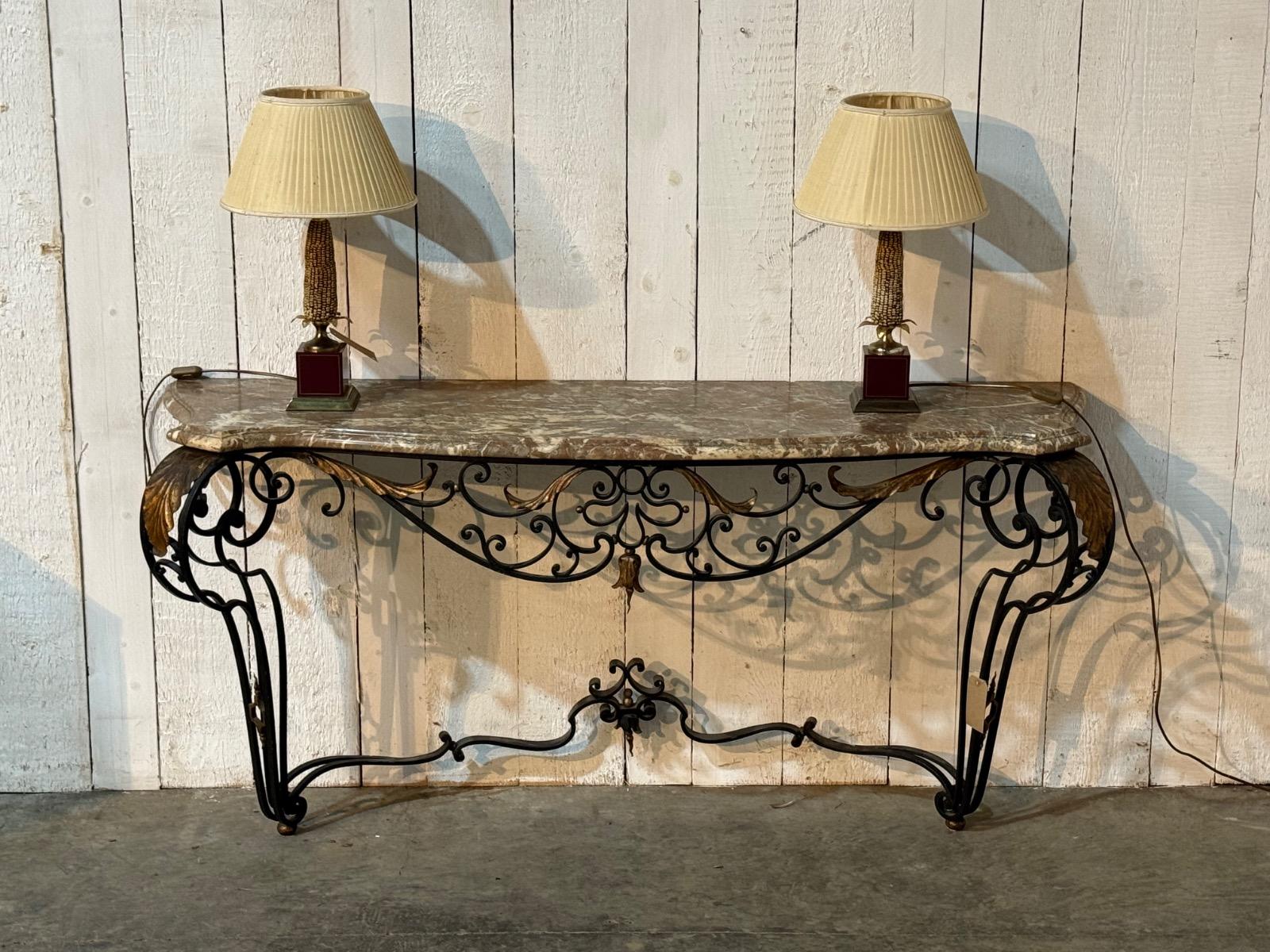 Wrought iron console with a marble top 