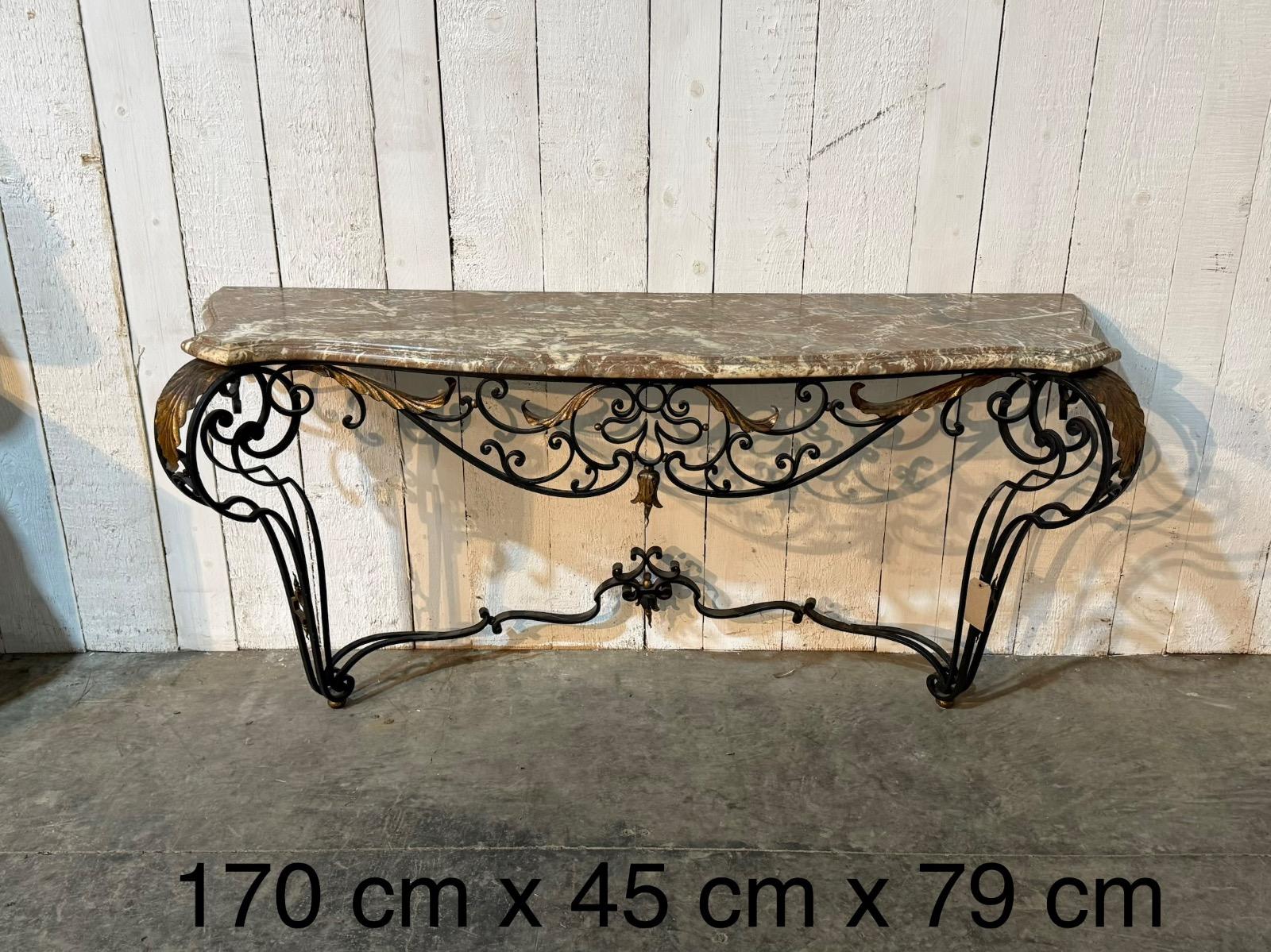 Wrought iron console with a marble top 