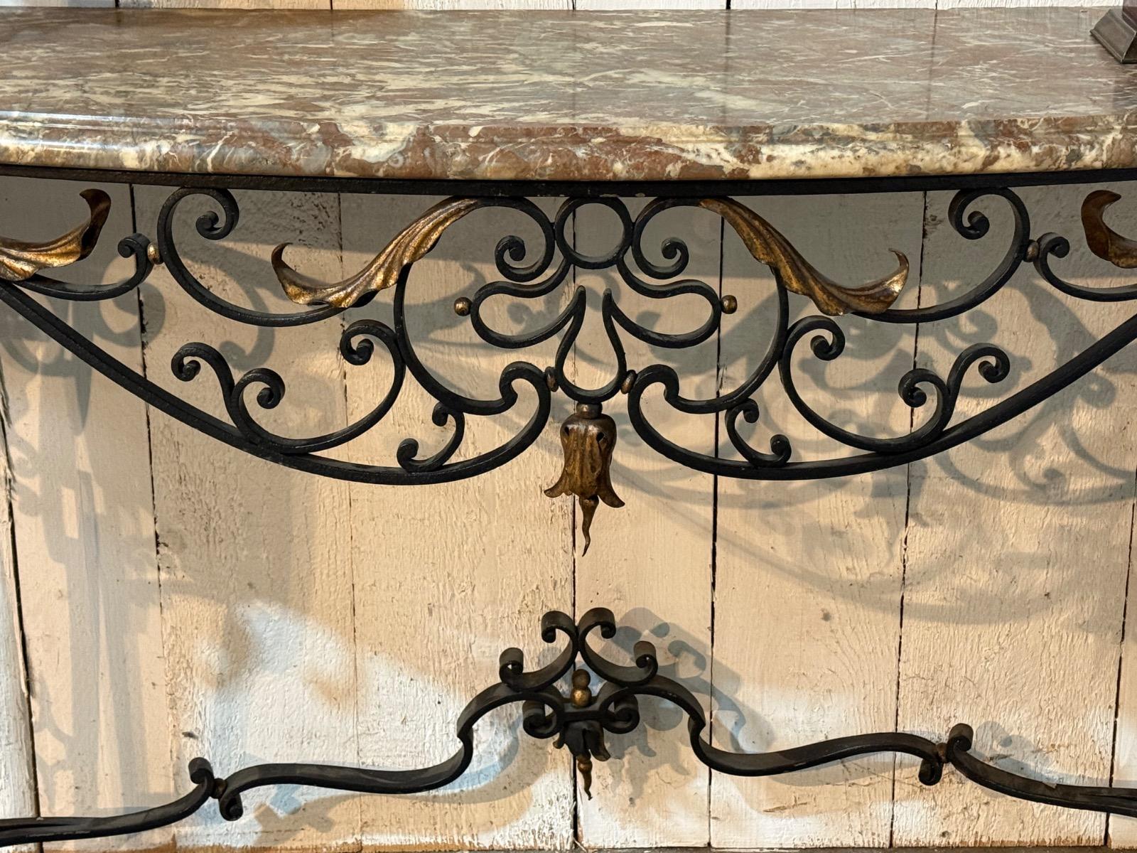 Wrought iron console with a marble top 