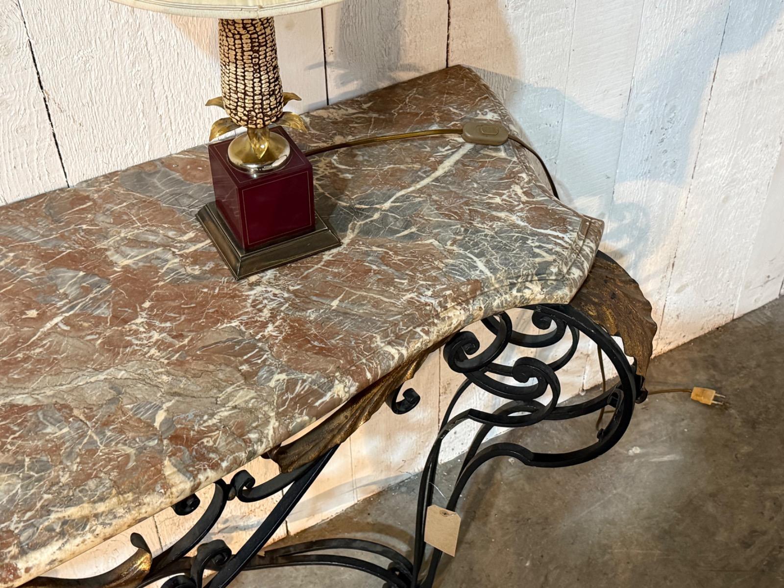 Wrought iron console with a marble top 