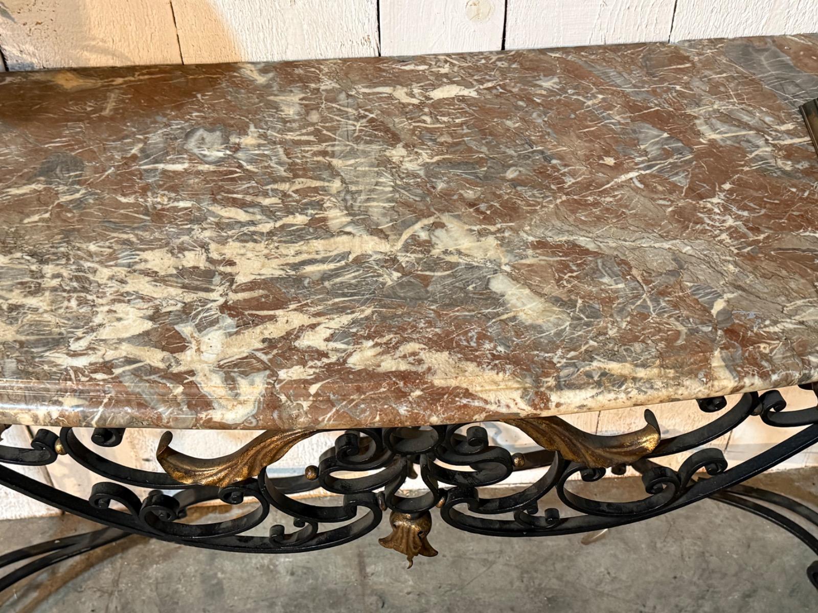 Wrought iron console with a marble top 