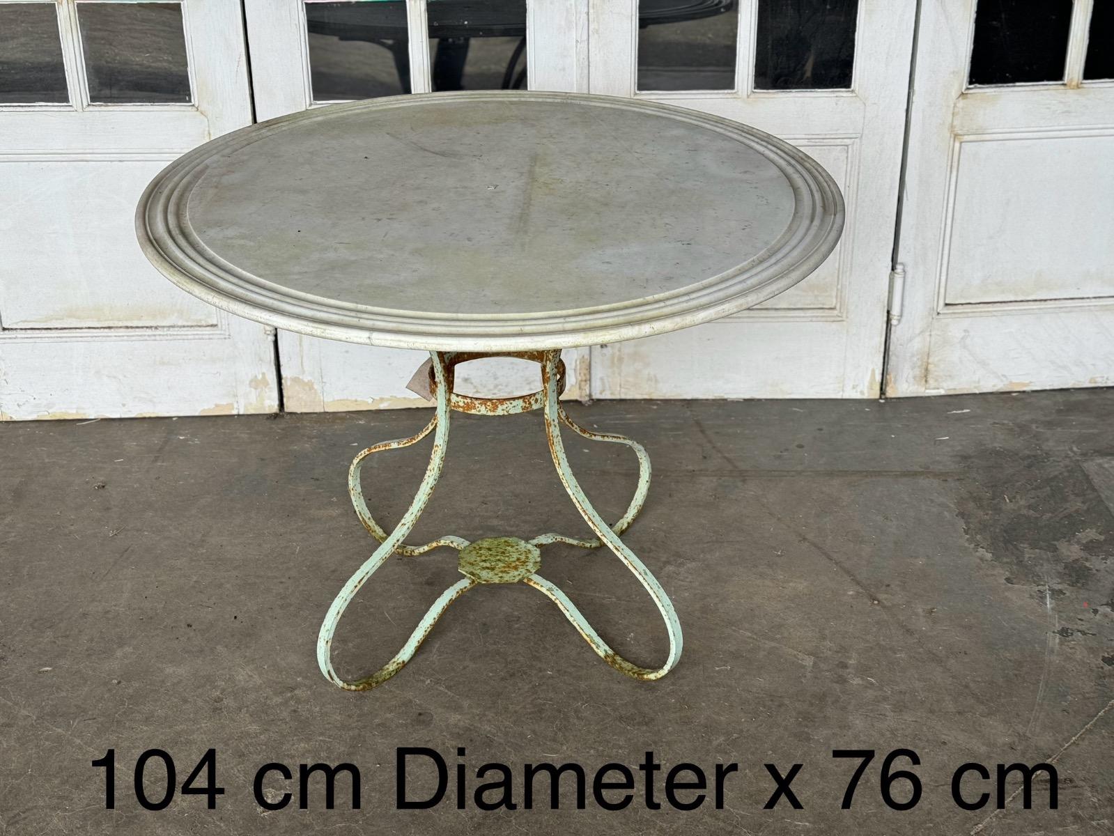 Wrought iron garden table with white marble top 